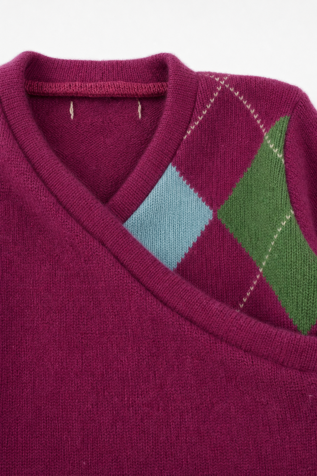 Detailaufnahme des Kaschmir Baby Longsleeves in Rosa, Größe 74/80