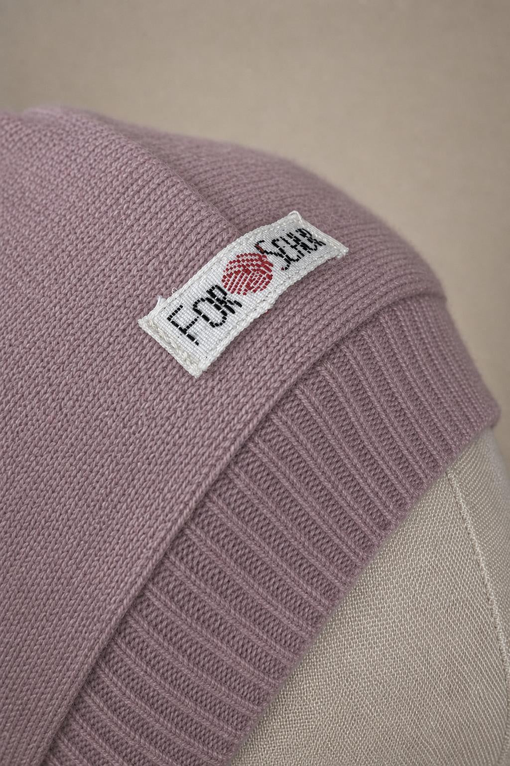 Detailaufnahme des Kaschmir Kapuzenschals in Rosa