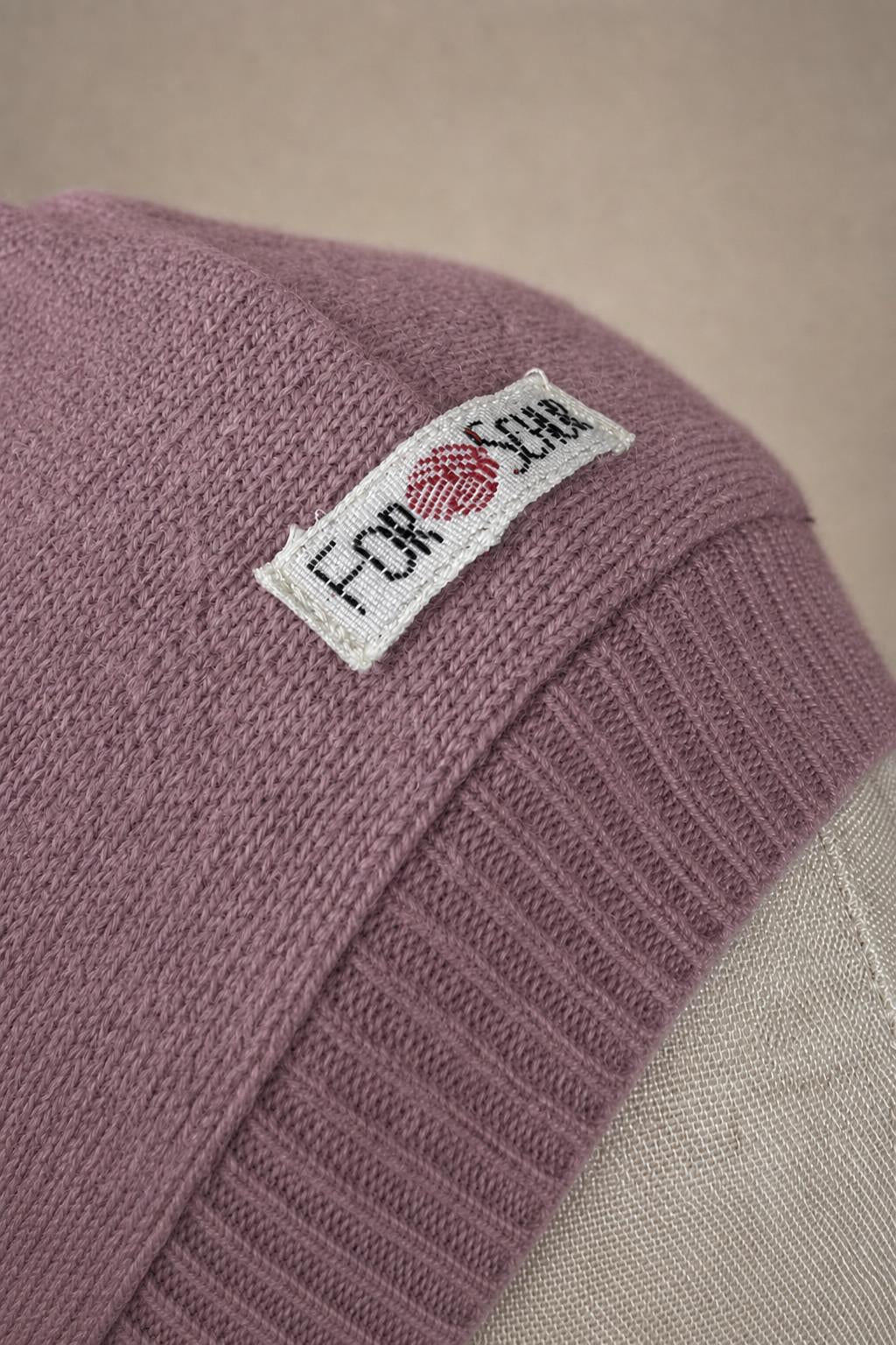 Detailaufnahme des Kaschmir Kapuzenschals in Rosa