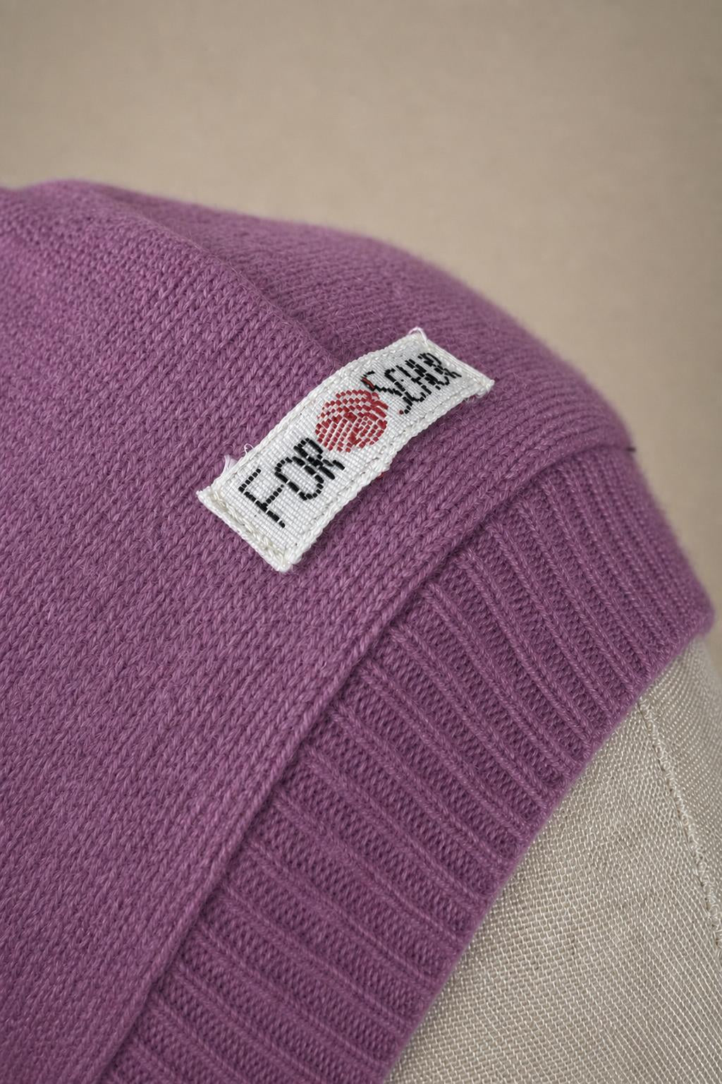 Detailaufnahme des Kaschmir Kapuzenschals in Rosa