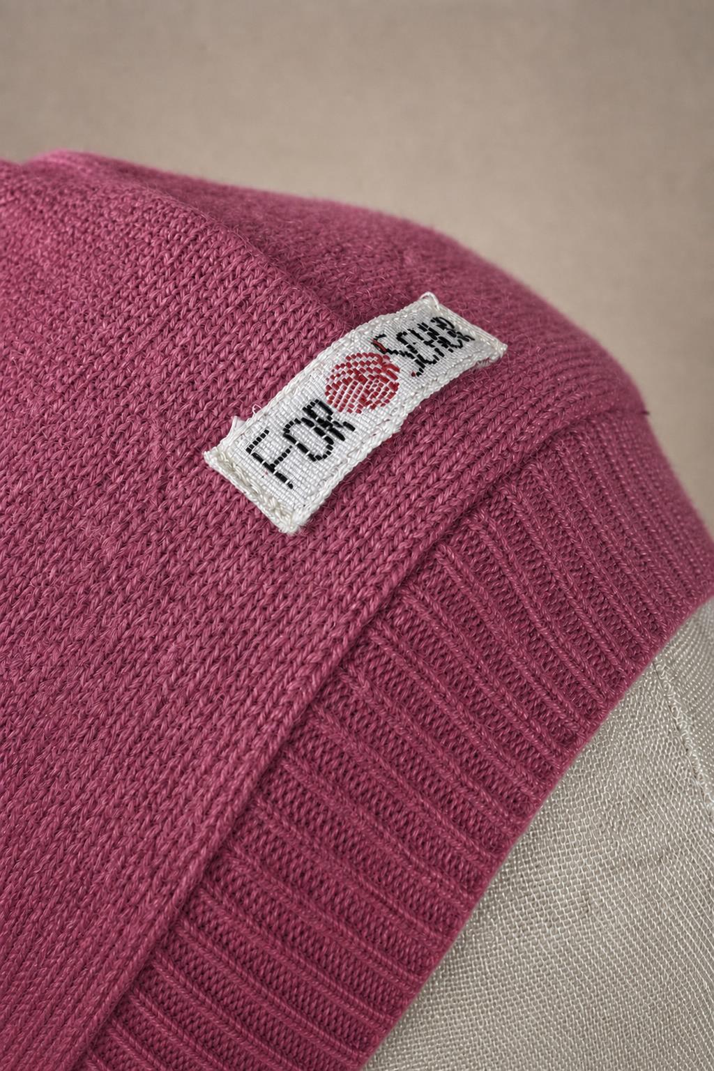 Detailaufnahme des Kaschmir Kapuzenschals in Rosa