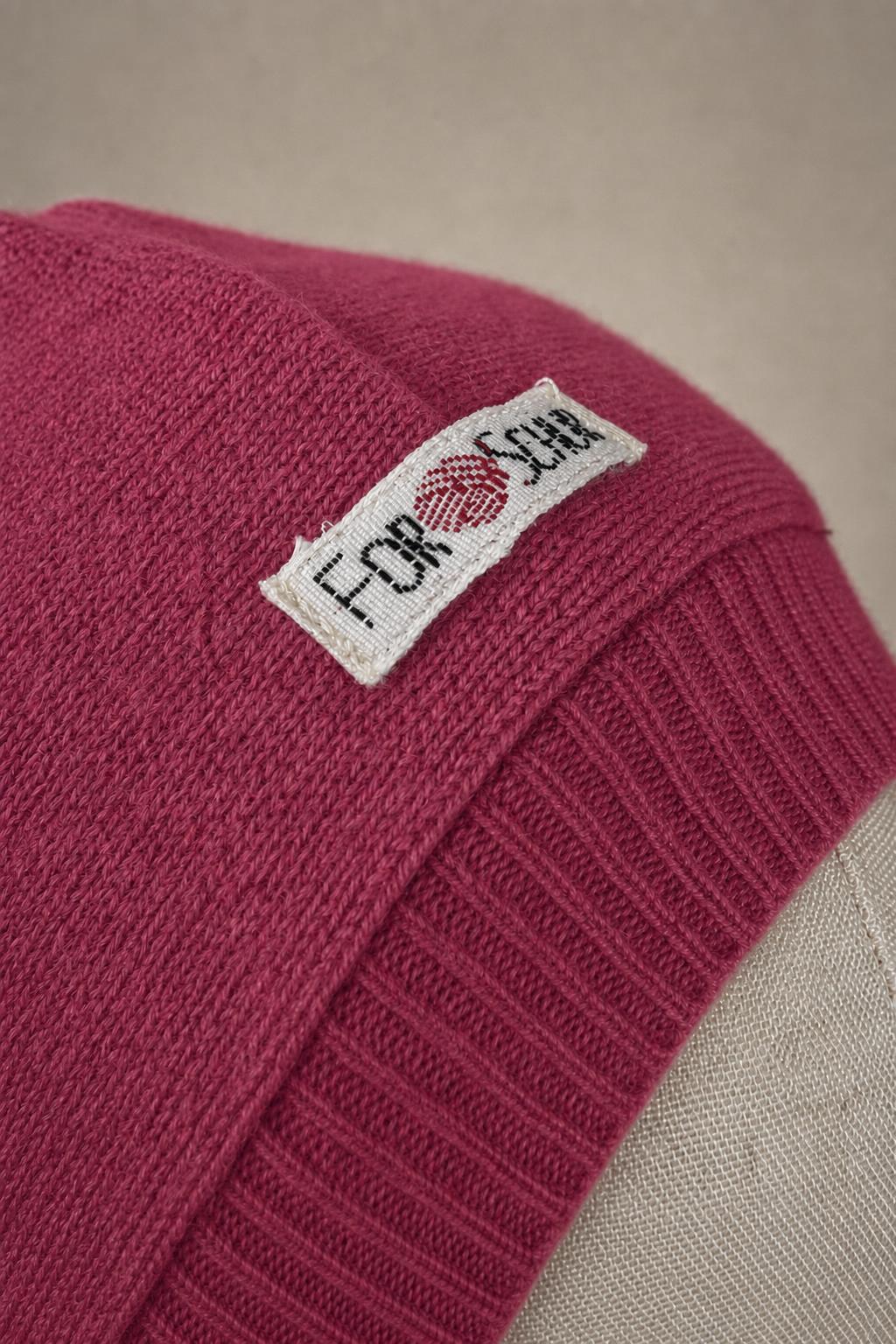 Detailaufnahme des Kaschmir Kapuzenschals in Pink