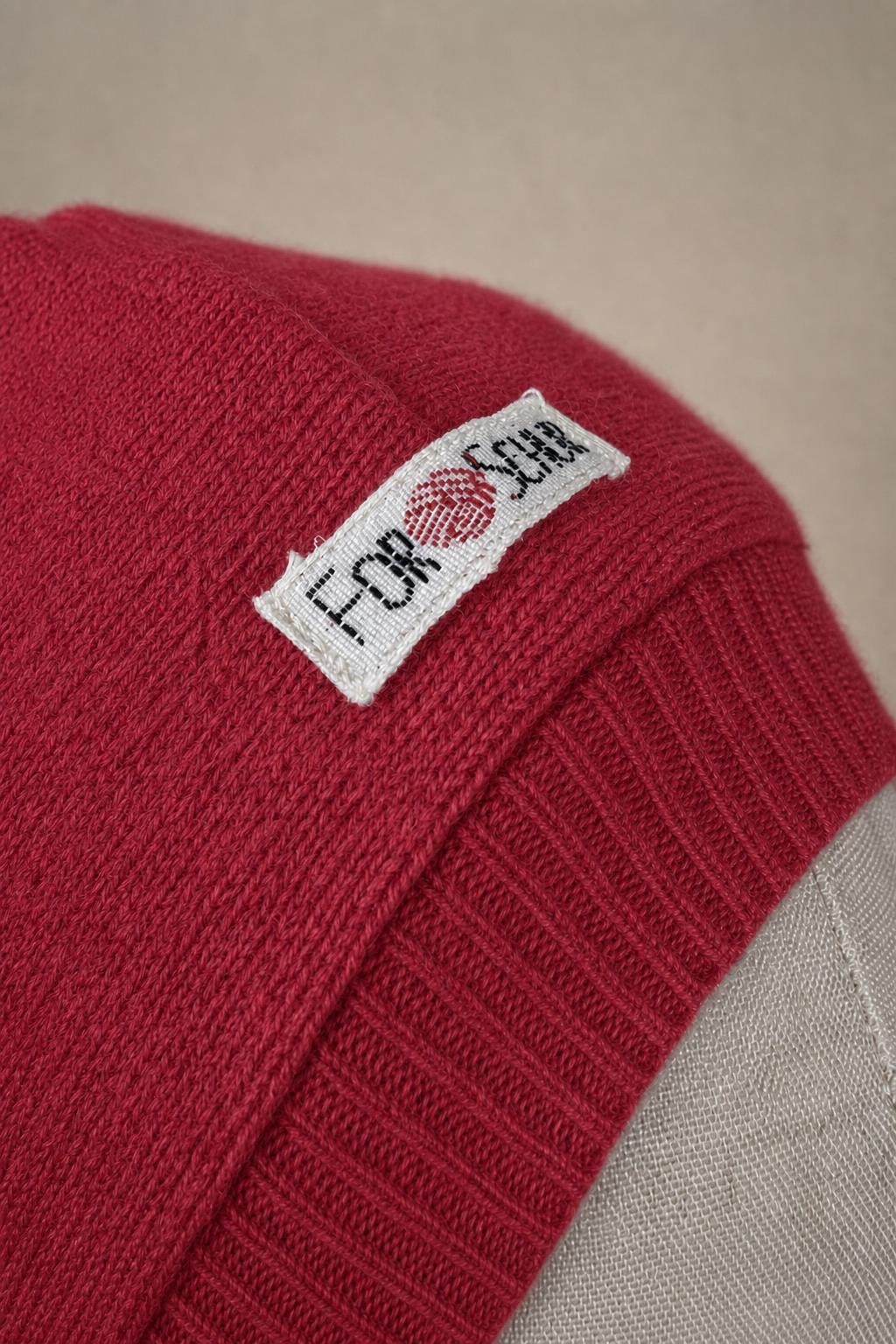 Detailaufnahme des Kaschmir Kapuzenschals in Pink