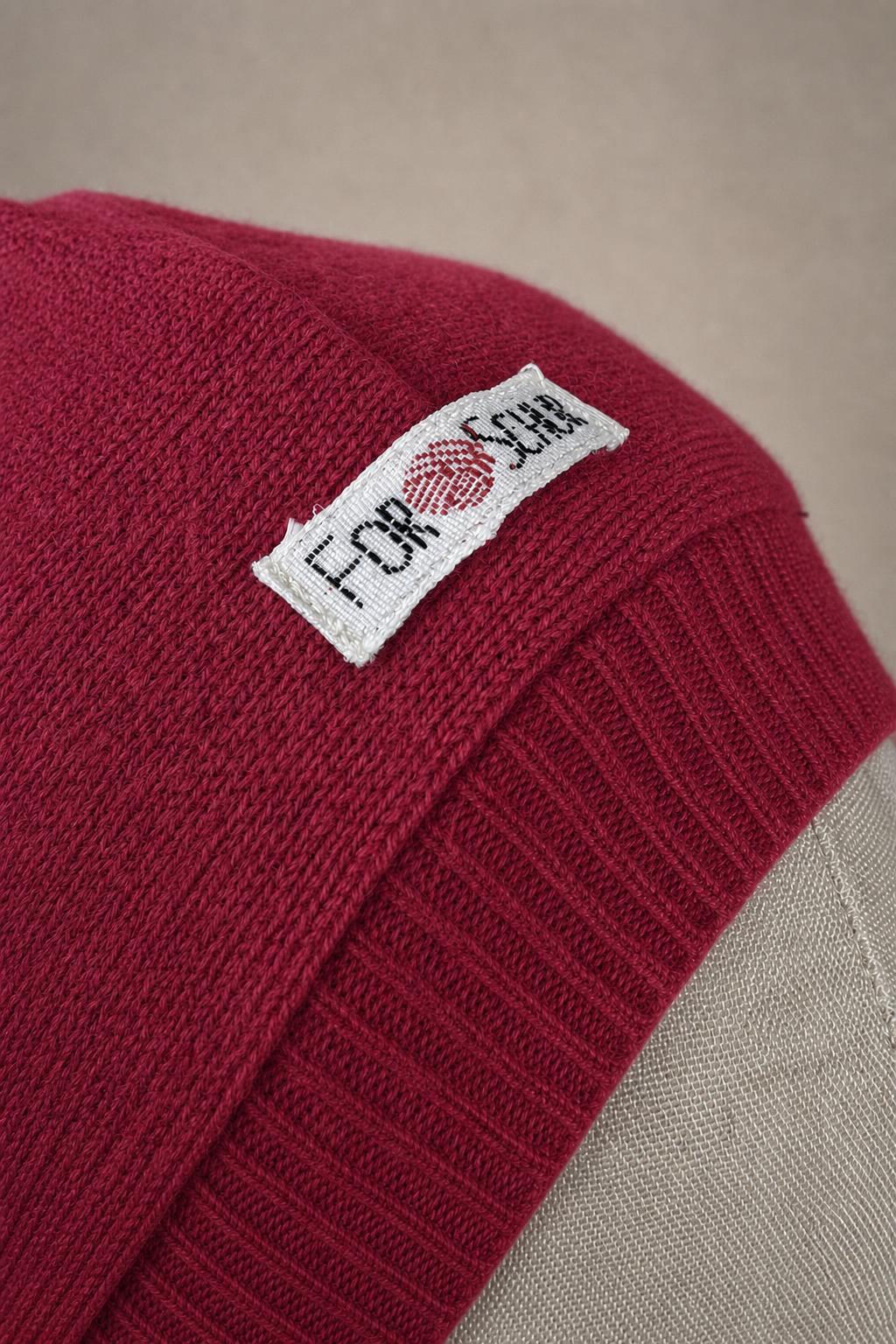 Detailaufnahme des Kaschmir Kapuzenschals in Pink