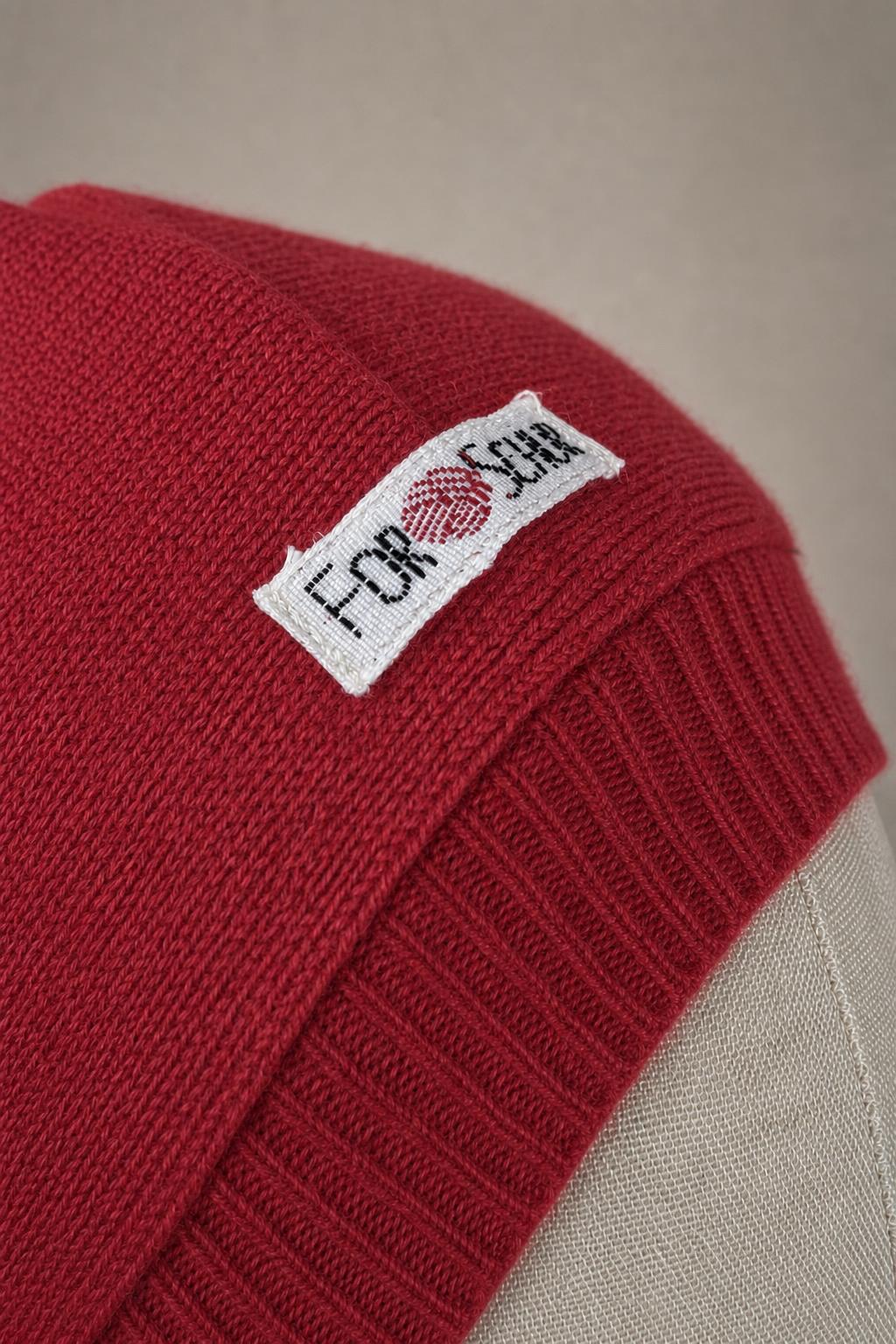 Detailaufnahme des Kaschmir Kapuzenschals in Pink