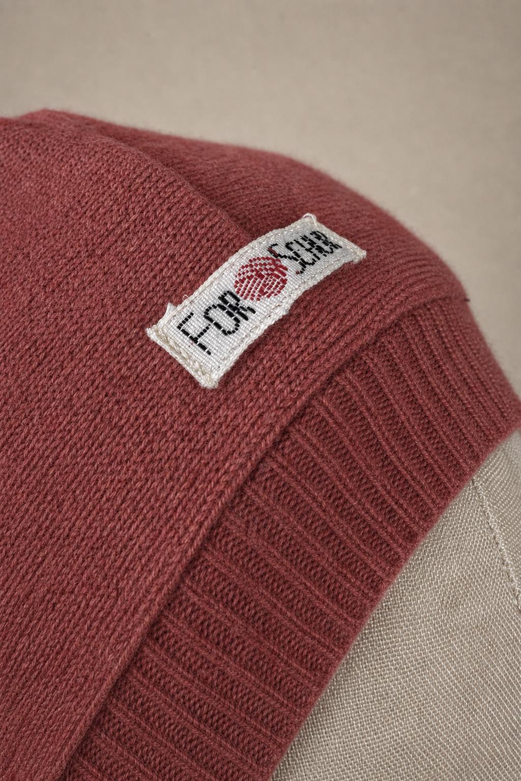 Detailaufnahme des Kaschmir Kapuzenschals in Rosa