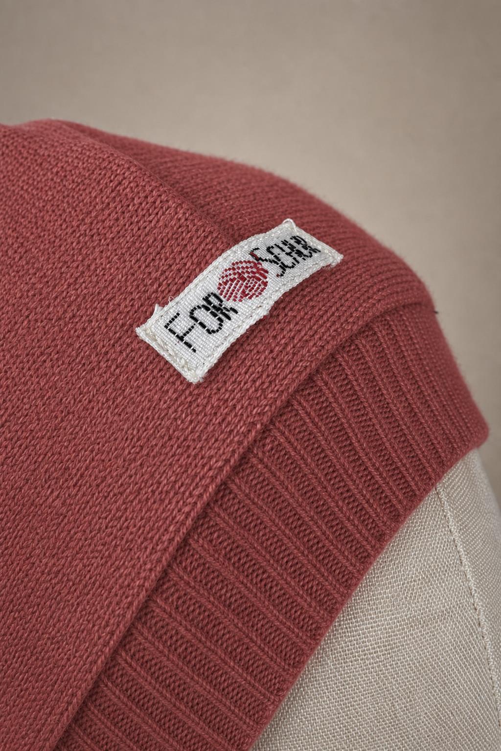 Detailaufnahme des Kaschmir Kapuzenschals in Rosa