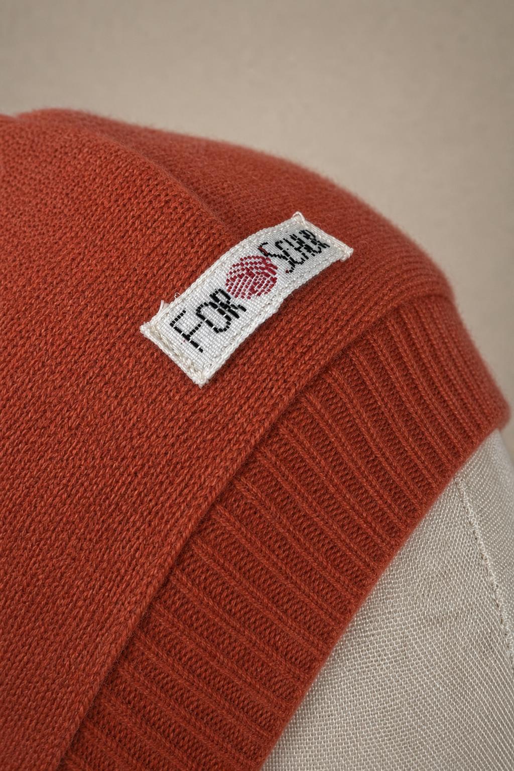 Detailaufnahme des Kaschmir Kapuzenschals in Rosa