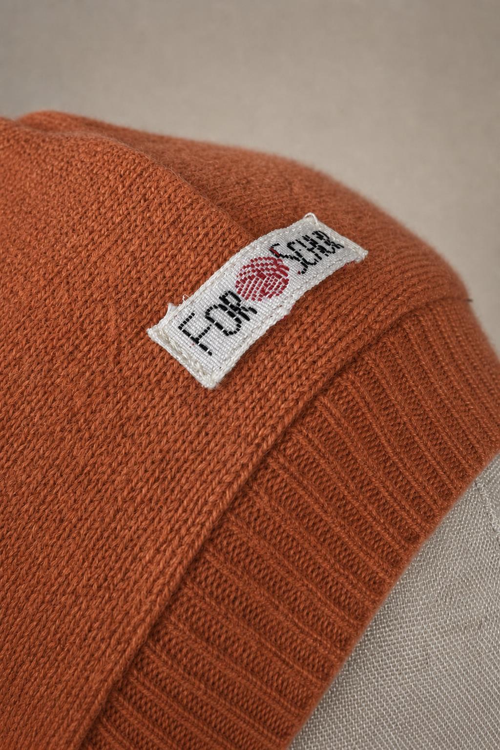 Detailaufnahme des Kaschmir Kapuzenschals in Rosa