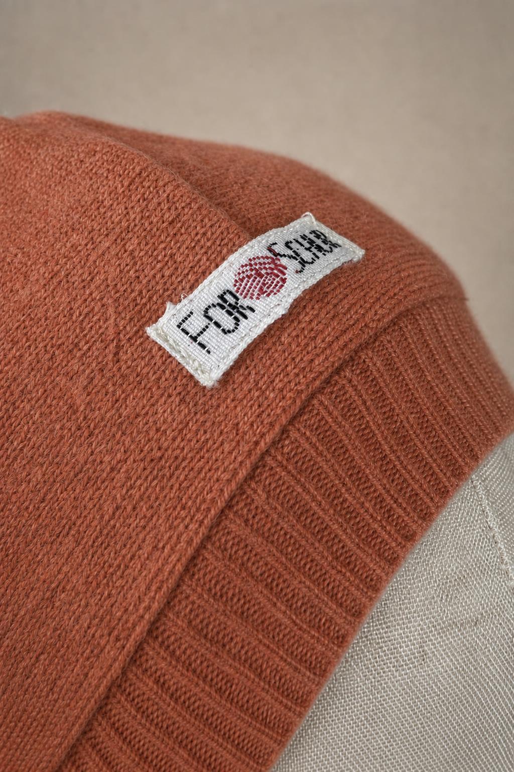 Detailaufnahme des Kaschmir Kapuzenschals in Rosa