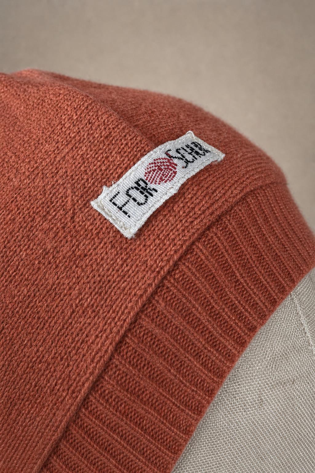 Detailaufnahme des Kaschmir Kapuzenschals in Rosa