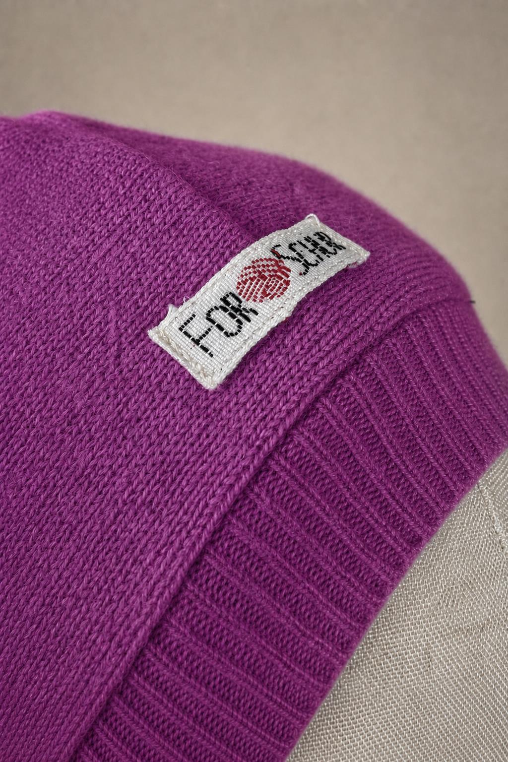 Detailaufnahme des Kaschmir Kapuzenschals in Lila
