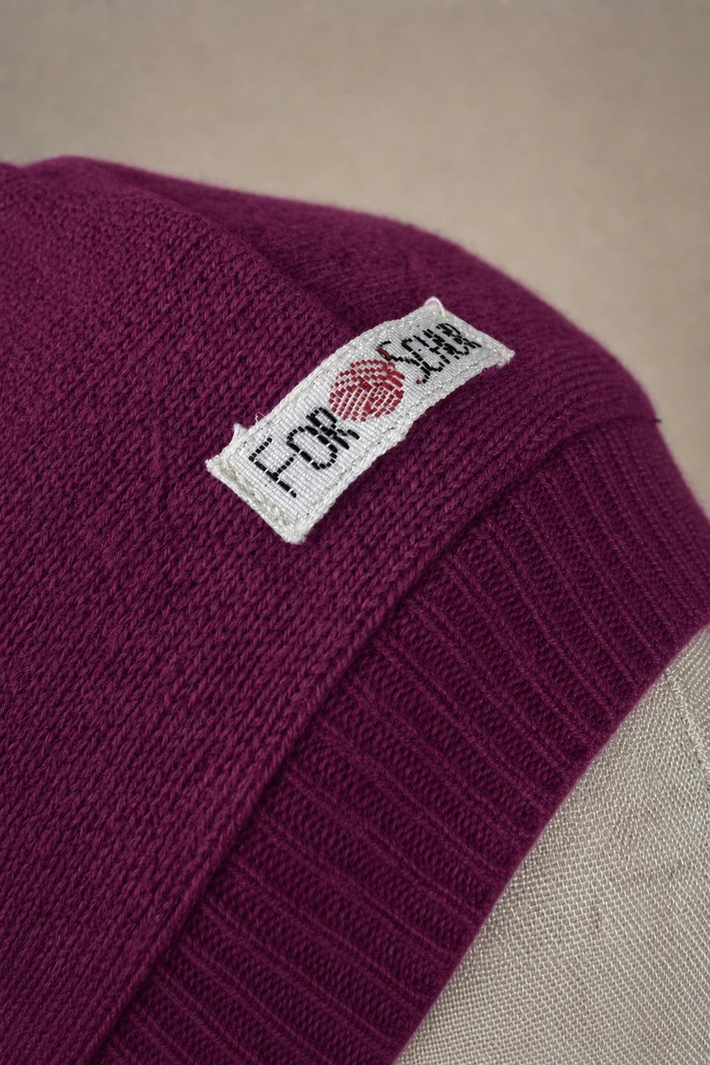 Detailaufnahme des Kaschmir Kapuzenschals in Lila