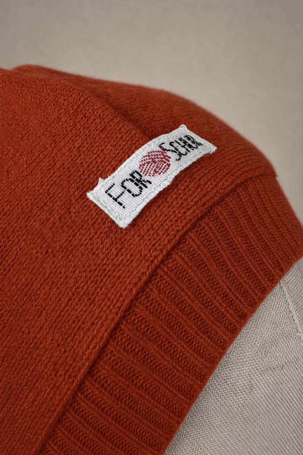 Detailaufnahme des Kaschmir Kapuzenschals in Orange
