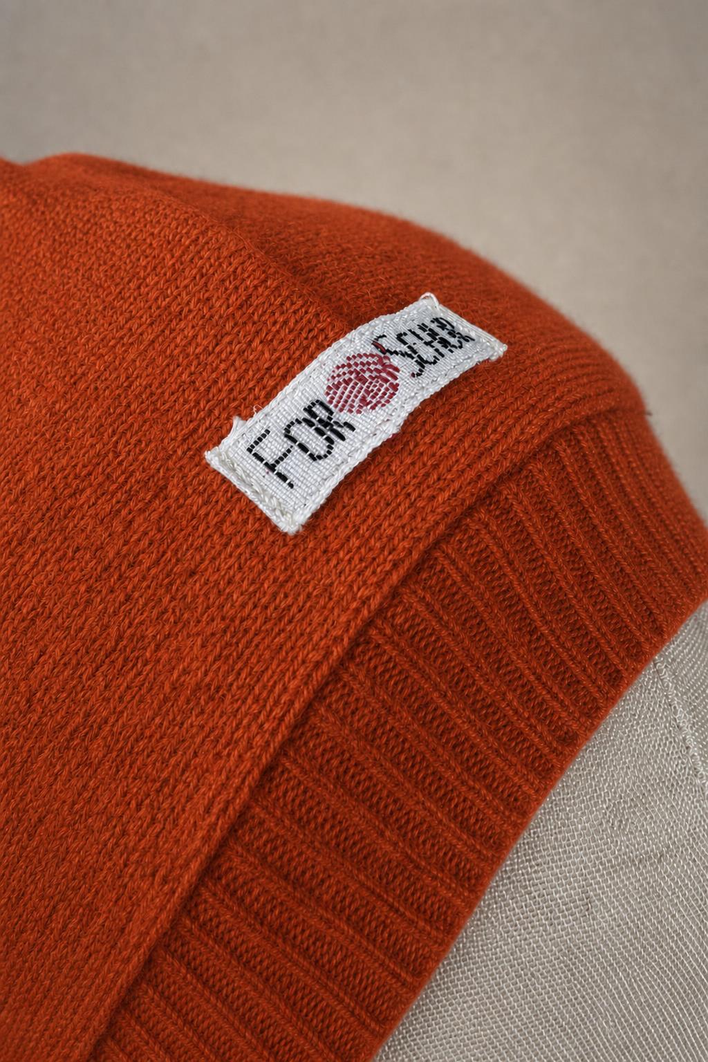 Detailaufnahme des Kaschmir Kapuzenschals in Orange