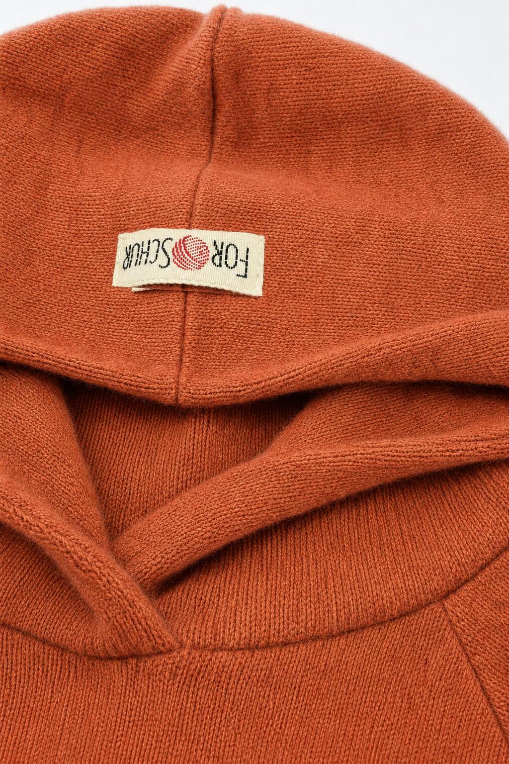 Detailaufnahme des Kaschmir Kinder Hoodies in Orange