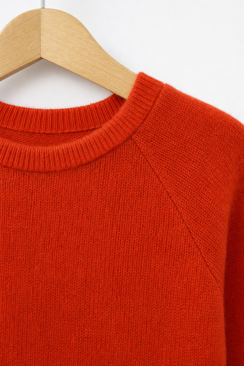 Detailaufnahme des Kaschmir Kinder Longsleeves in Orange, Größe 98/104