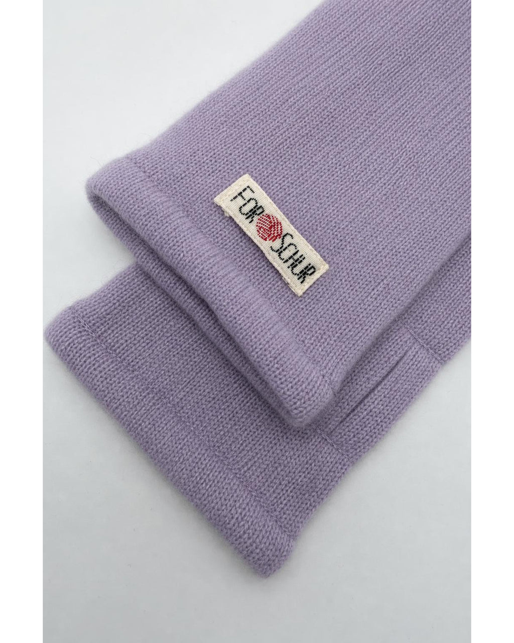 Detailaufnahme der Kaschmir Handstulpen in Rosa