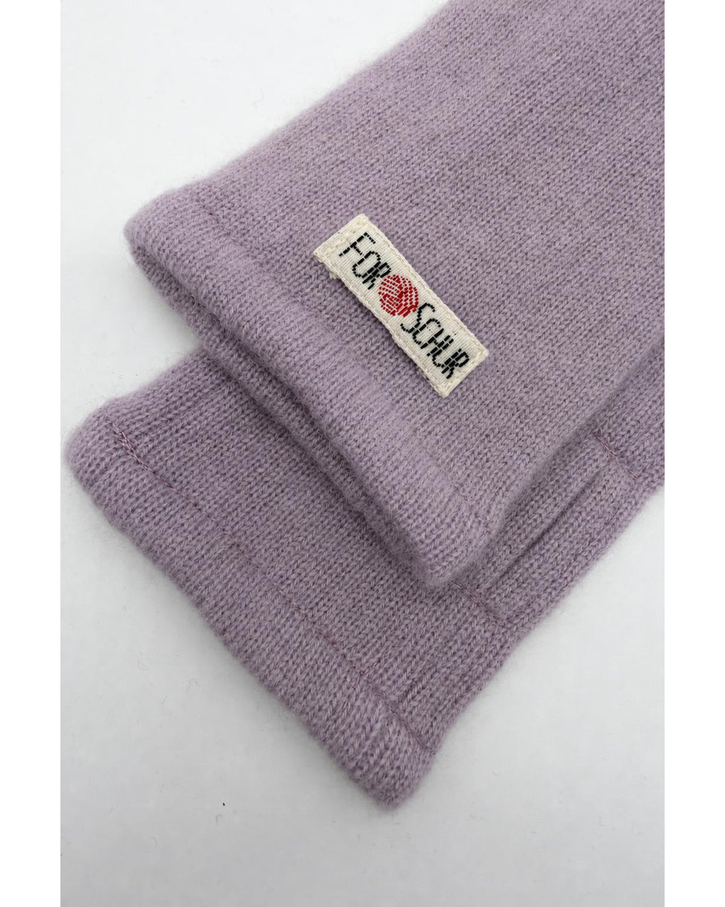 Detailaufnahme der Kaschmir Handstulpen in Rosa