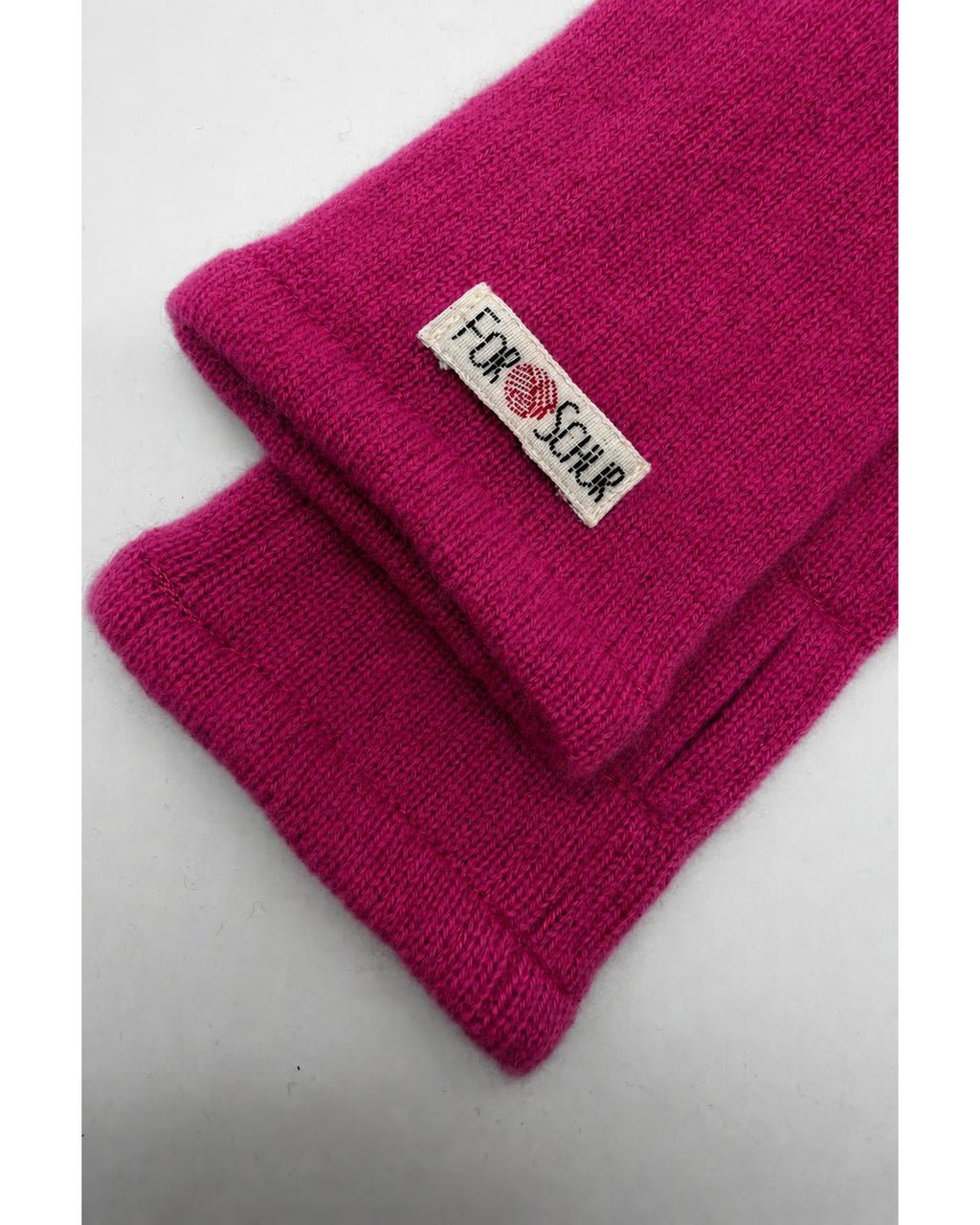 Detailaufnahme der Kaschmir Handstulpen in Rosa