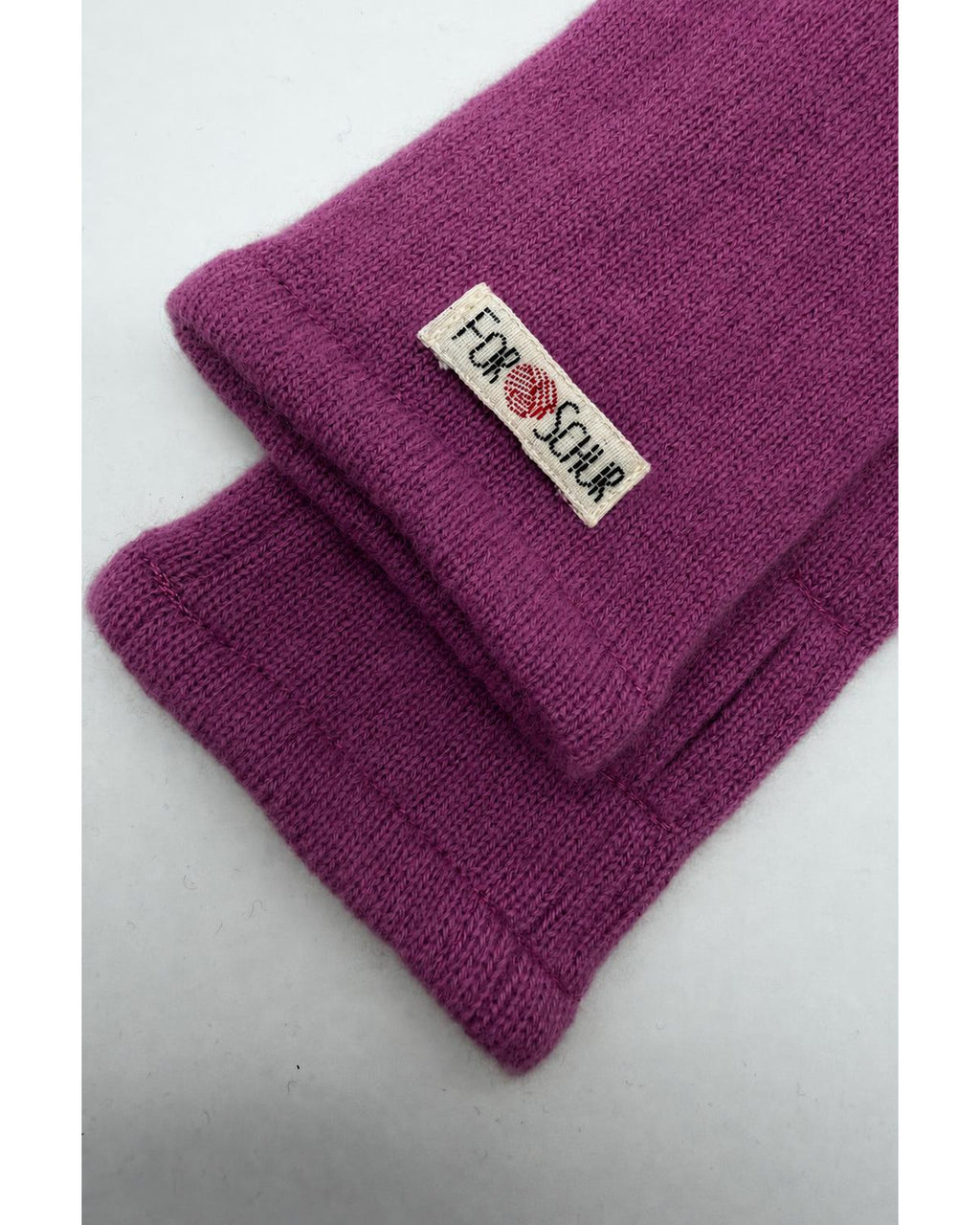 Detailaufnahme der Kaschmir Handstulpen in Rosa