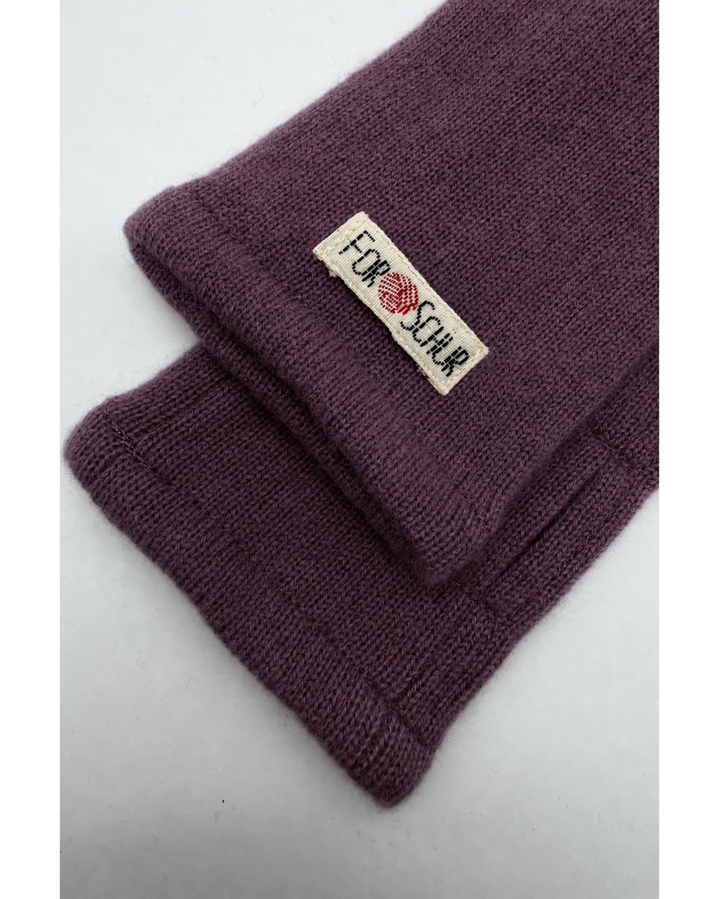 Detailaufnahme der Kaschmir Handstulpen in Rosa