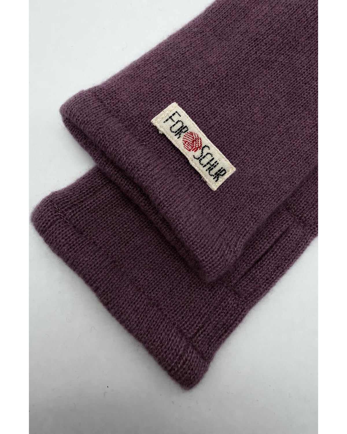 Detailaufnahme der Kaschmir Handstulpen in Rosa