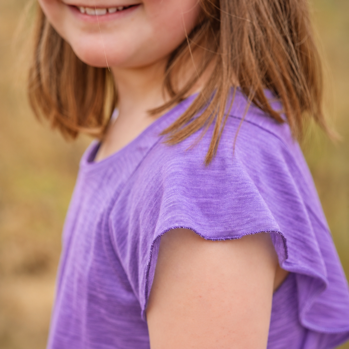 Sommermerino Kinderbluse mit Flügelärmeln